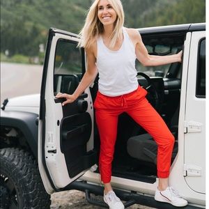 ZYIA small red everywhere zipper joggers. NWT